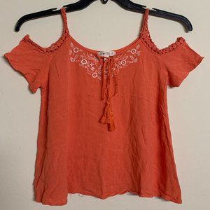 EYE-CATCHING ORANGE TOP WITH FLORAL DESIGN